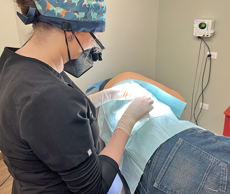 Dr. S. Alison Basak treating a patient.
