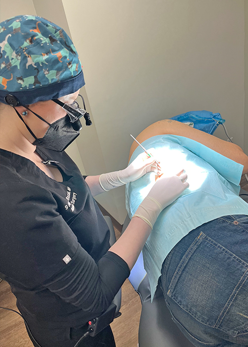 Dr. Basak treating a patient.